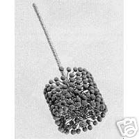 Flex-Hone tool with long shaft and cluster of small rounded balls.