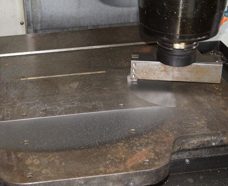 Fly cutter on a milling machine in an industrial setting.