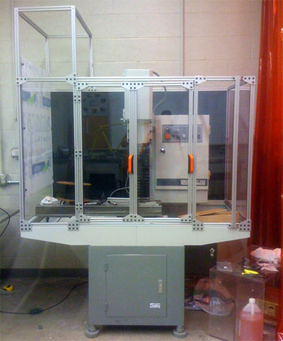 A large metal enclosure with a glass door and transparent access.