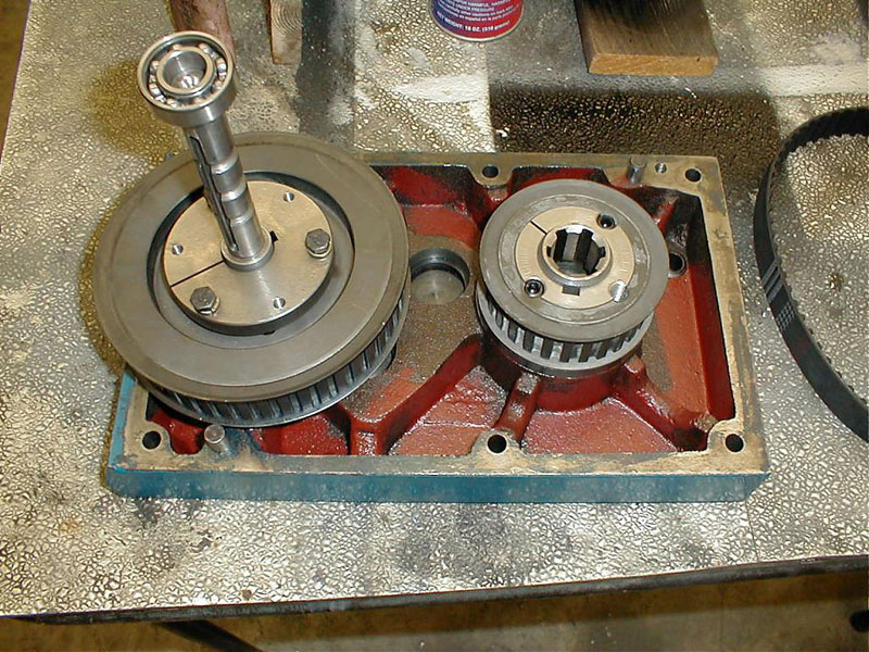 Intricate internal mechanics of an I-beam belt drive.