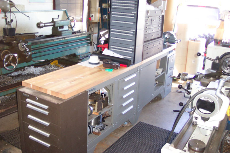 Well-organized metal fabrication workshop with lathe and mill.
