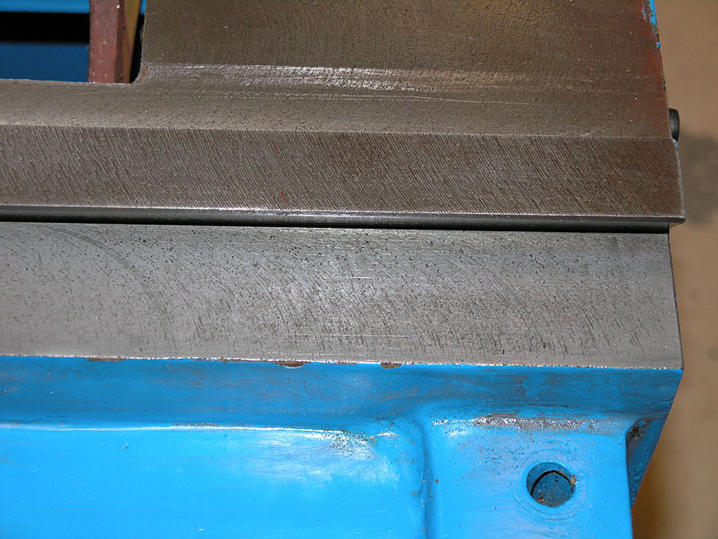 Blue metal vise with gray textured finish.