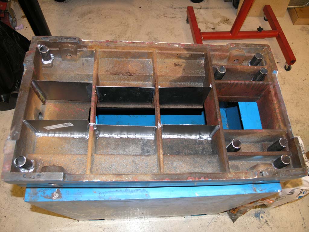 Large metal storage box with internal compartments.