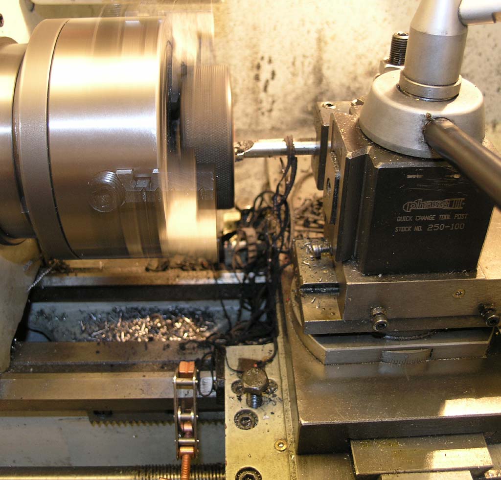 Machining on a lathe with metal workpieces.