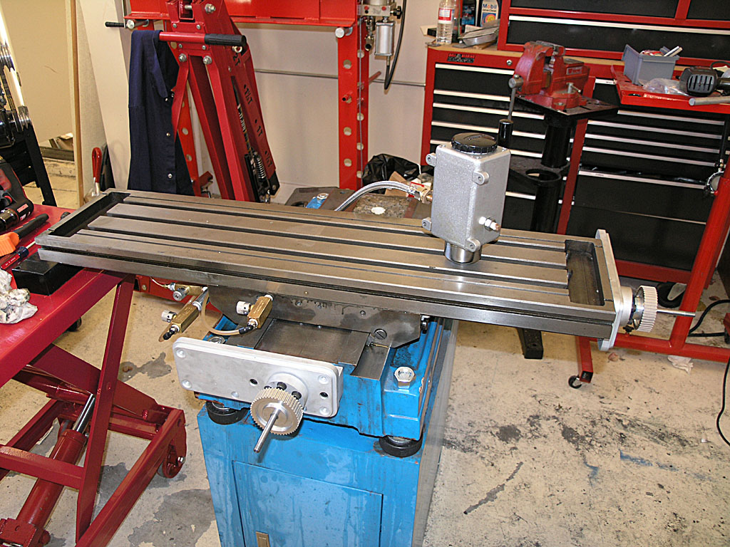 Large metal table with horizontal slotted surface.