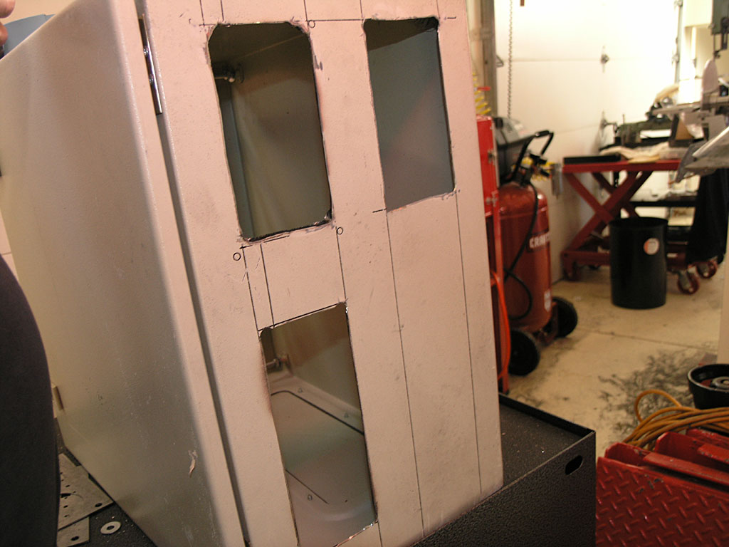 Metal object with rectangular cutouts.