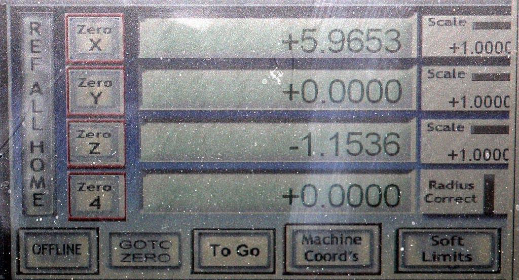 Old control panel with buttons and displays from a machine shop or manufacturing facility.