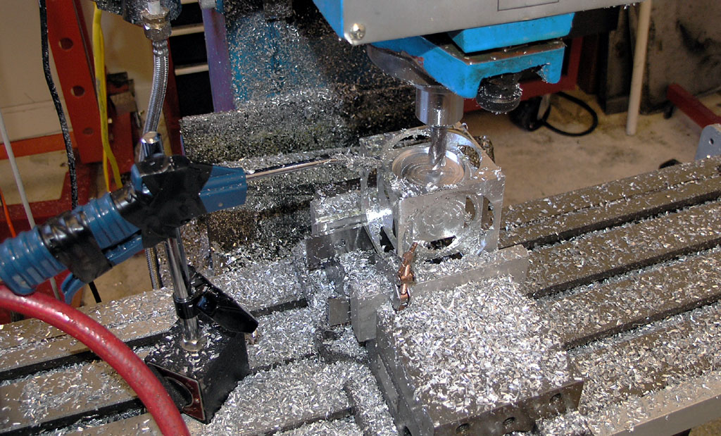 Metalworking machine with metal shavings and visible components.