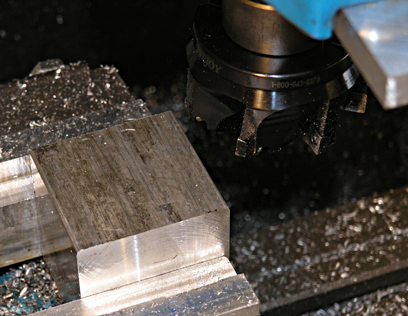 Metalworking tools and equipment in a machine shop or factory setting.