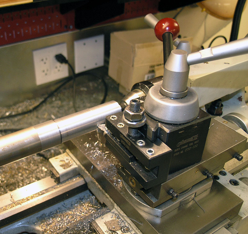 Lathe tool on workbench in metalworking environment.