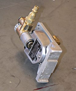 Metallic component with brass-colored protrusion.