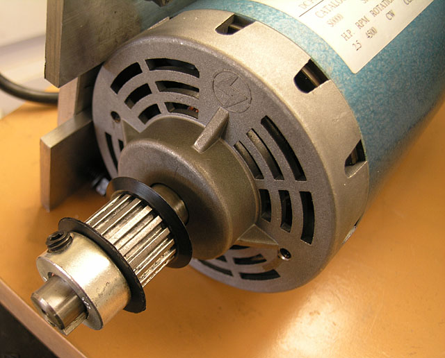 Silver-colored motor rotor with black center ring and metal housing, surrounded by a blue outer casing with a high RPM rating.