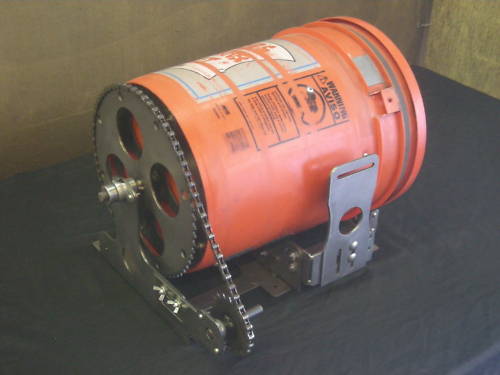 Cylindrical orange container with metal chain and label.