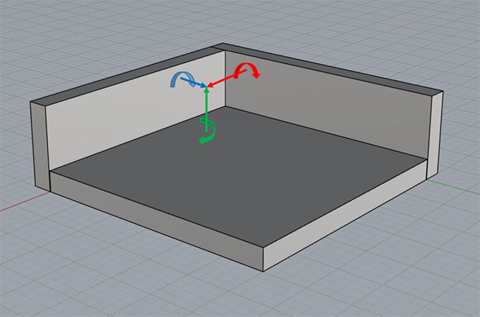 A rectangular object with colored lines and arrows demonstrating orientation or positioning in machining or CNC machine contexts.