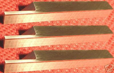 Machined metal part with rough surface and tool marks.