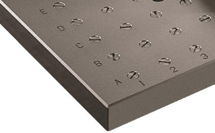 Metal fixture plate with circular screw holes in a grid pattern.