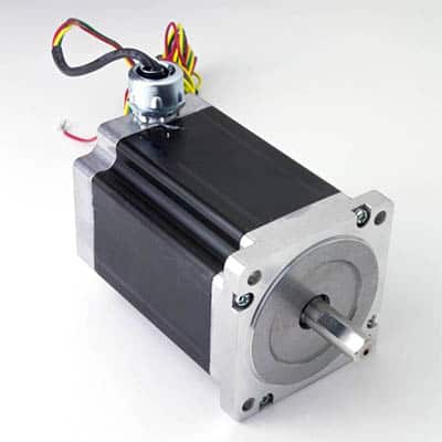 Black rectangular object with silver metal plate and cylindrical protrusion.