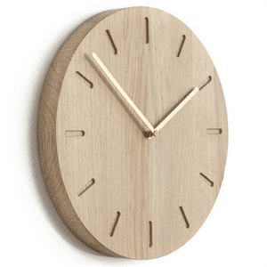 Light-colored wooden wall clock with a minimalist design.