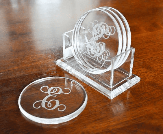 Crystal clear acrylic laser engraved with custom monogram.
