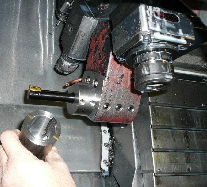 Metalworking environment with machinery components and tools.