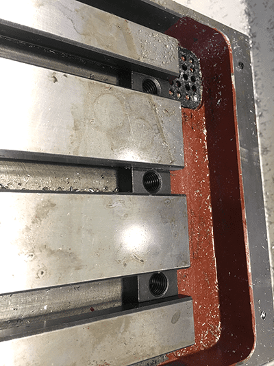 Metal component with visible bolts or screws.