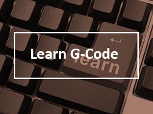 Close-up of a computer keyboard with "Learn G-Code" button.