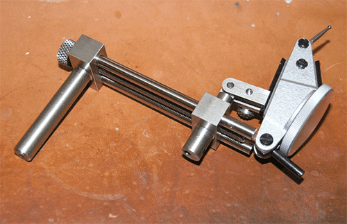 Metal hand vise with long handle and adjustable jaws featuring a knurled knob.
