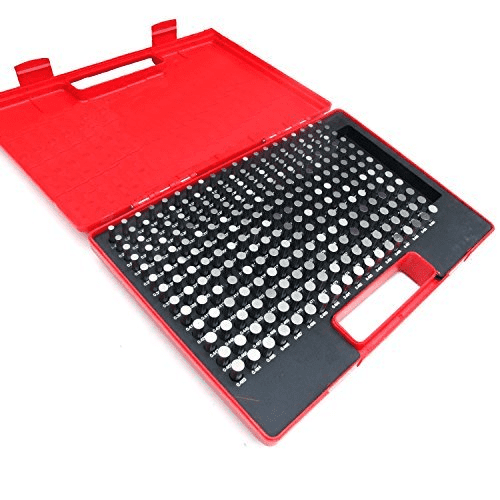 Red plastic case with hinged lid open, showing a grid of small metal tools.