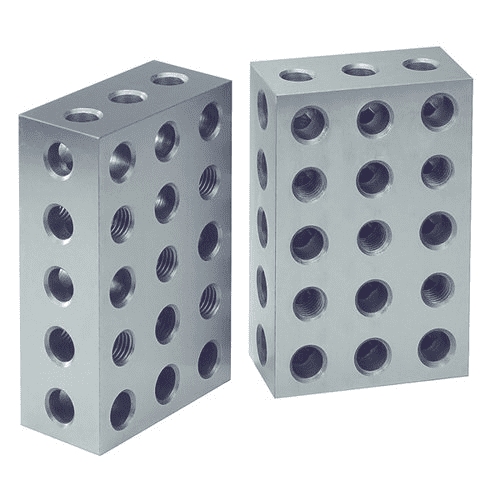 Rectangular metal block with evenly spaced circular holes.
