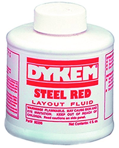 White plastic Dykem steel red layout fluid bottle with red logo and warning labels.