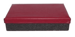 Rectangular red box with textured surface and subtle pattern of small bumps.