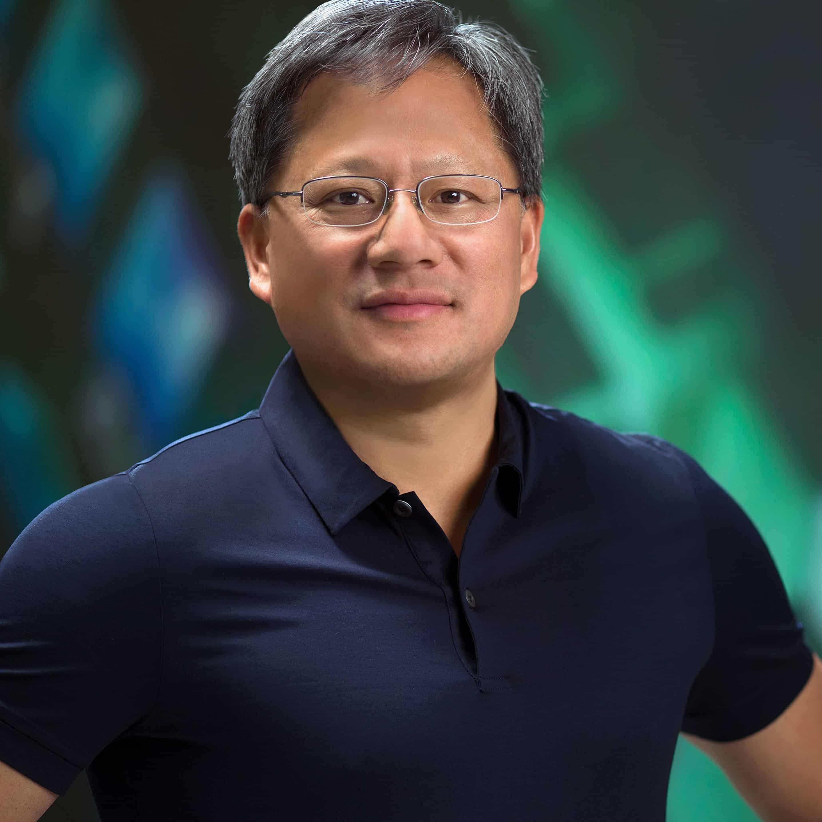 Jen-Hsun Huang, co-founder of NVIDIA, wearing glasses and a black polo shirt.