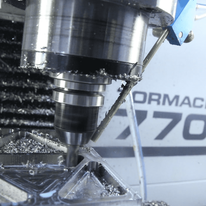 Metalworking machine cutting tool in action, ORMAC 770 logo displayed.