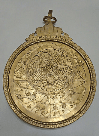 Brass astrolabe with engraved globe and surrounding text.