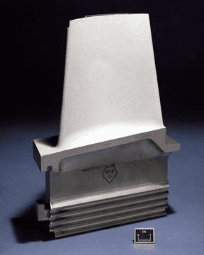 Metal part with rectangular base and flat top.