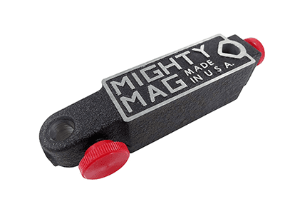 Black metal object with red knobs and "MIGHTY MAG MADE IN U.S.A." text.