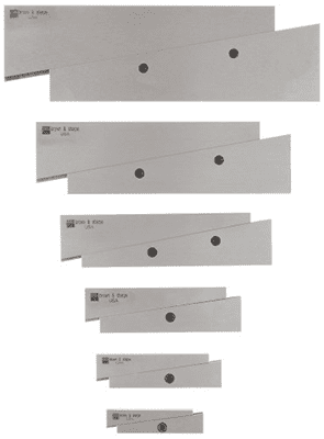 Grayscale image of stacked metal strips with central holes.