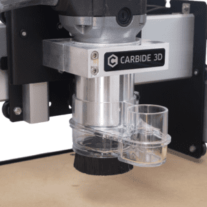 Close-up of a silver metal component with a black "Carbide 3D" label.