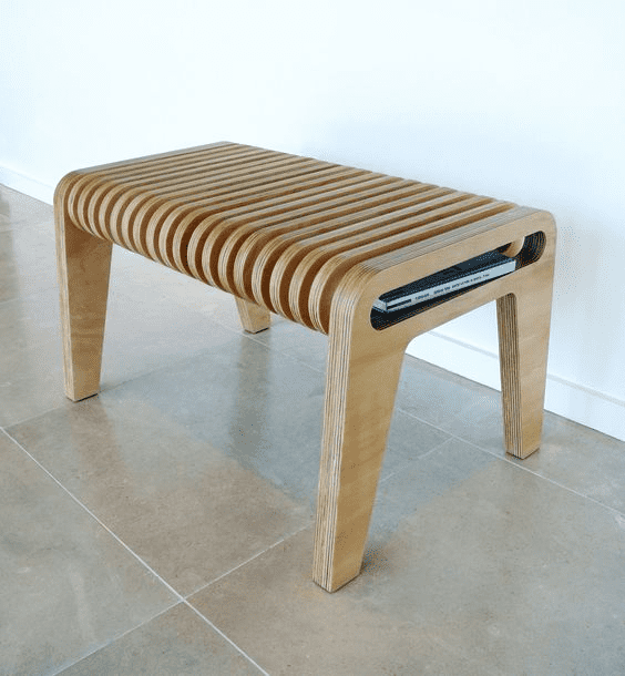 Compact wooden bench with curved slats made from light-colored wood.