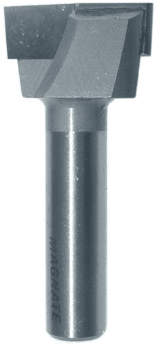 A metal tool with the word "MAGNATE" engraved on it, cylindrical body and flat top.