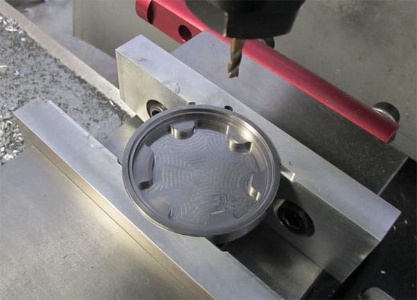 A large round soft jaw mold being machined on a CNC machine.