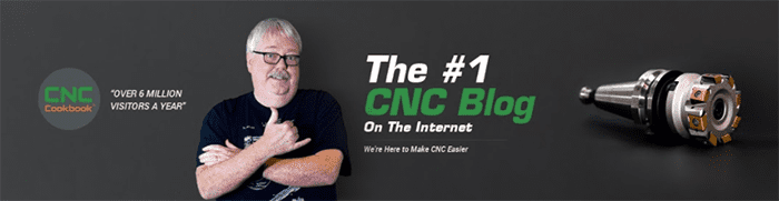 A man in his 50s with white hair and glasses gestures to the right against a dark grey background.