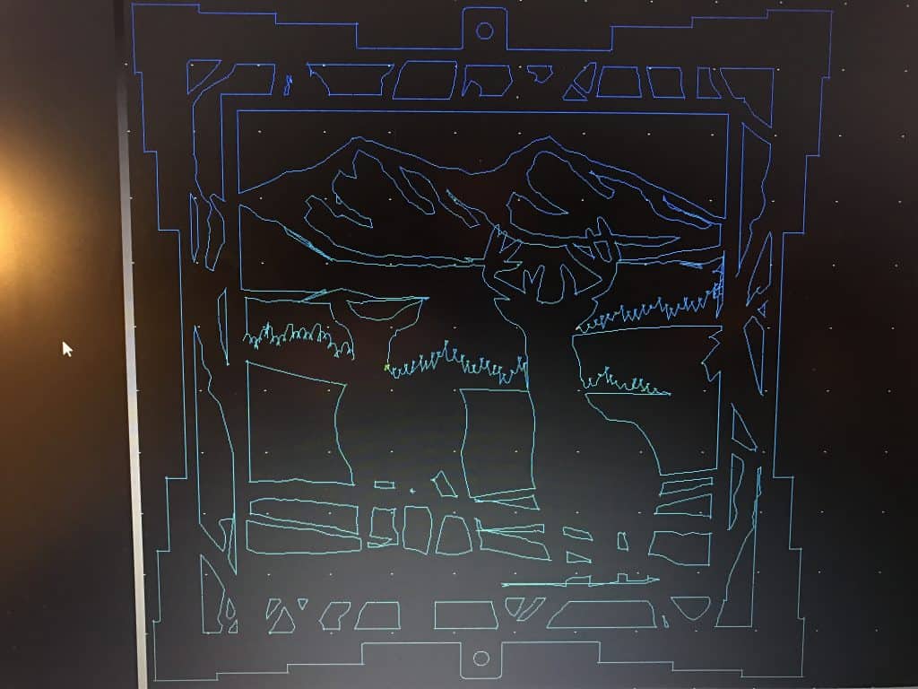 Computer-generated design with two deer and a mountain range, featuring a small offset effect.