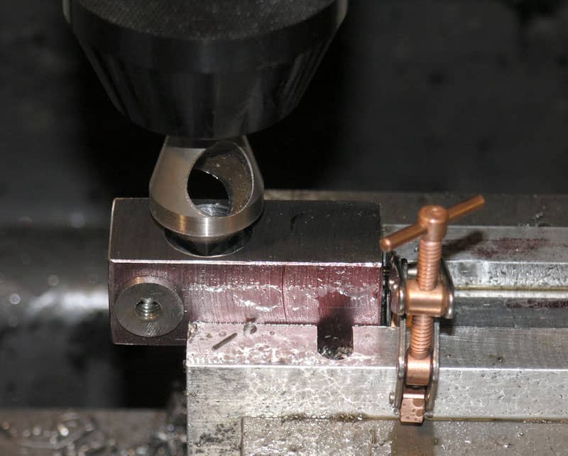 Metalworking tool in machine shop or manufacturing setting.