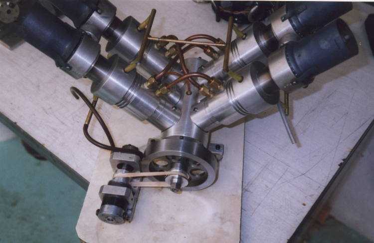 Four silver metal cylinders with copper wires.