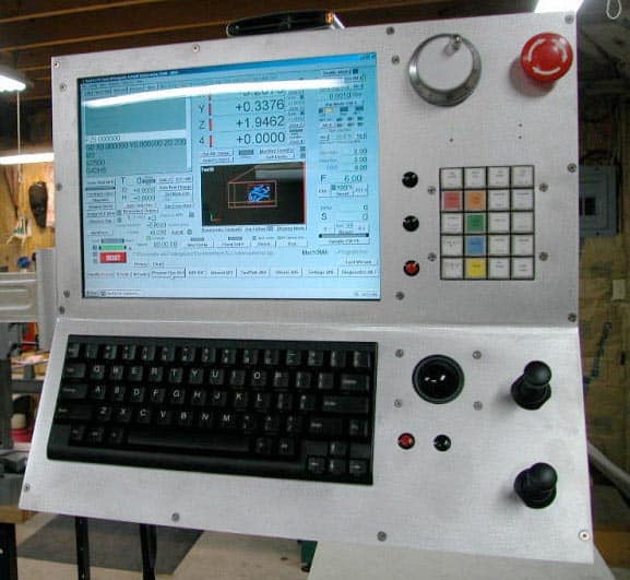 Industrial touchscreen monitor with attached keyboard displaying data and controls.