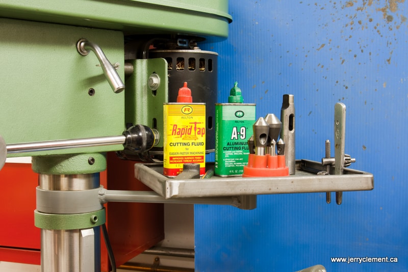 Drill press with cutting fluids and lubricants.