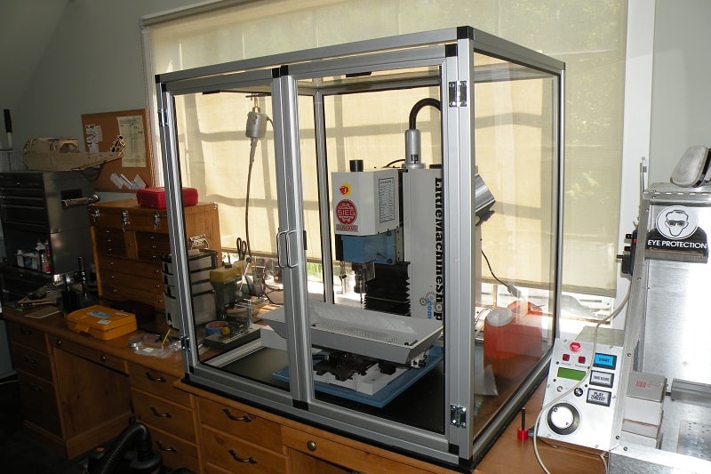 Metal shop workshop with CNC machines and equipment.