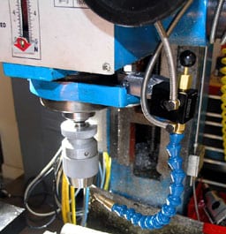 Machine control panel with wires and connectors.