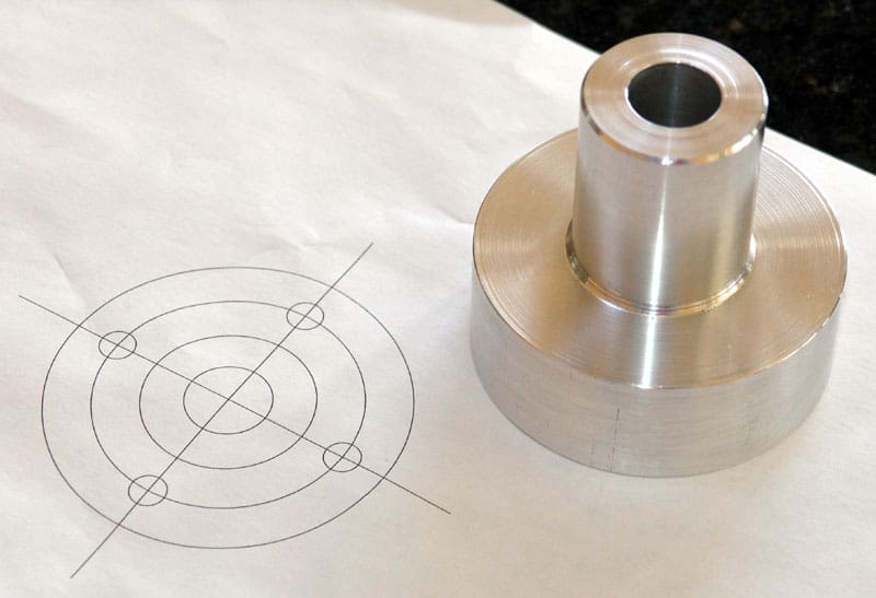 Technical drawing of metal parts on white paper with precision-crafted design.